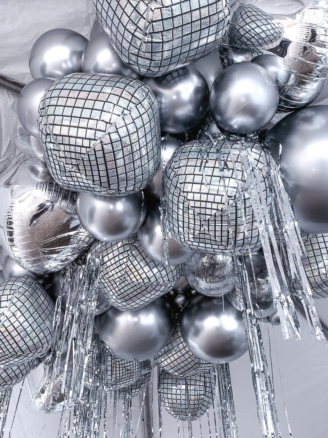 Elevate Your Event with a Stunning Disco Ball Balloon Ceiling Installation